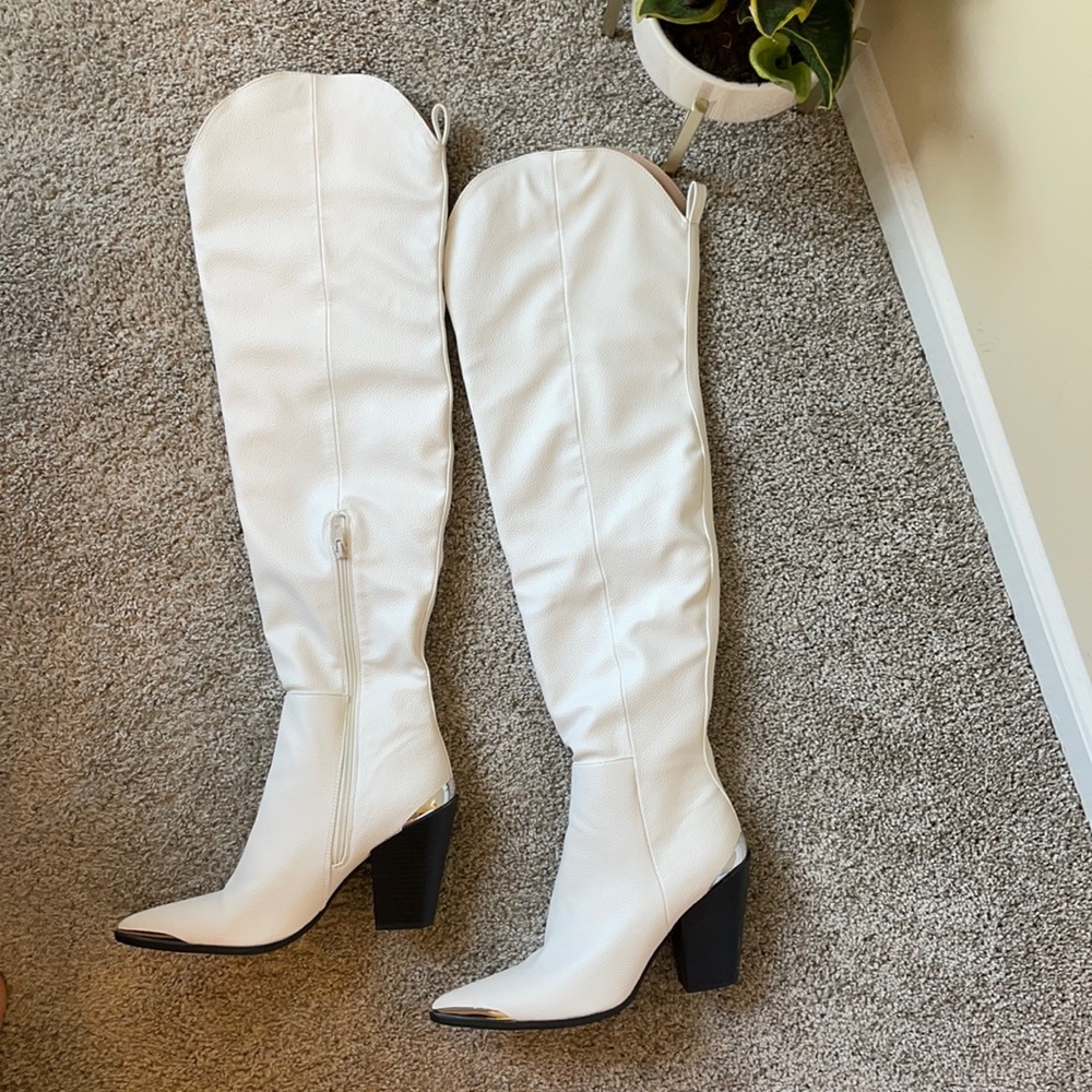 White booties. Knee high Never been worn Brand new